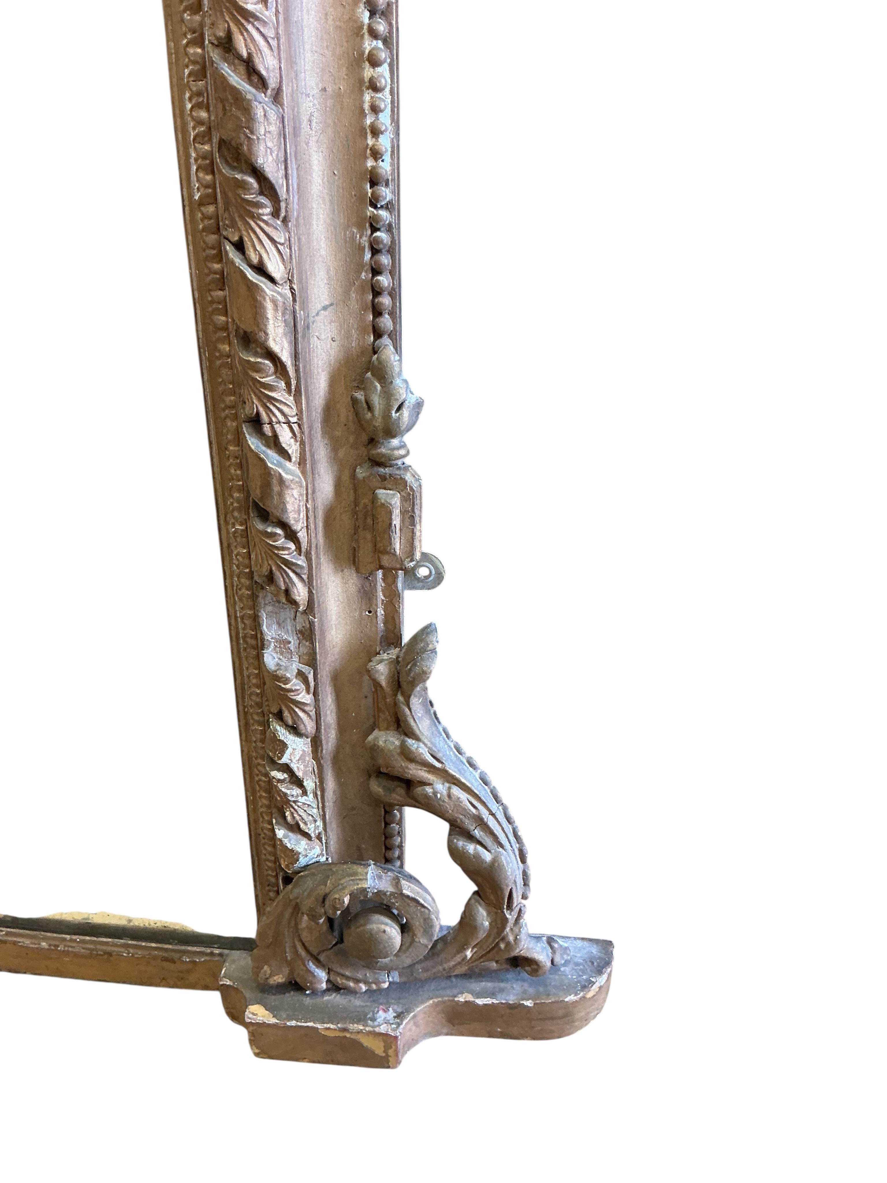 A Victorian giltwood and composition overmantel mirror, width 136cm, height 144cm